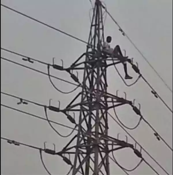 Shocker! Frustrated Man Climbs High Tension Pole, Demands Money Before Coming Down (Video)